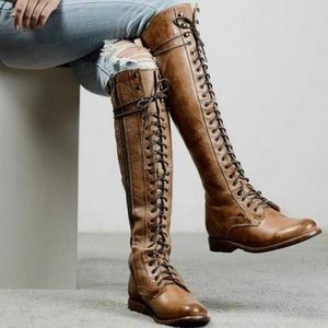 Artisan leather lace up tan boots.